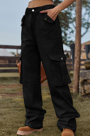 Black utility cargo pants with wide legs and multiple snap-button pockets.