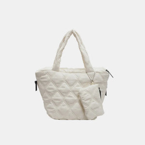 Quilted ivory shopper tote bag with matching pouch and silver charm detail.