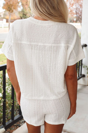 White textured knit drawstring short set with short sleeves and a relaxed fit.
