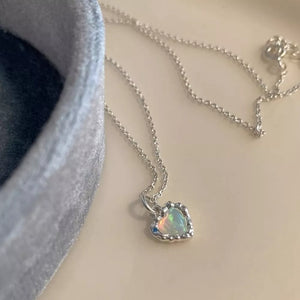 Silver heart pendant necklace with opal inlay and textured setting