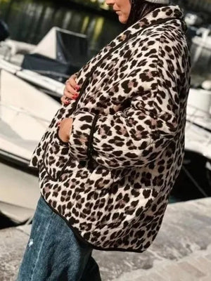 Leopard quilted kimono jacket with pockets and black trim.