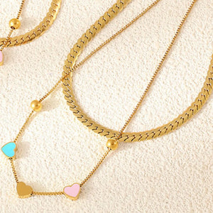 Gold double layered necklace with heart charms and beads