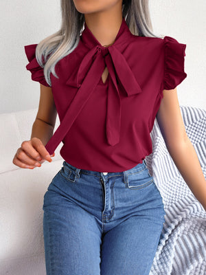 Burgundy ruffled sleeve pussybow blouse with keyhole neckline.