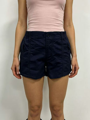 Navy cargo shorts with button closure and multiple pockets.