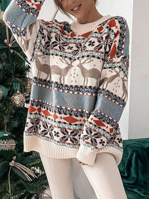 Fair Isle reindeer motif knit sweater in cream with crew neck and long sleeves.