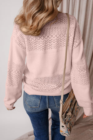 Perforated knit v-neck pullover sweater in dusty pink with allover eyelet pattern and relaxed fit.