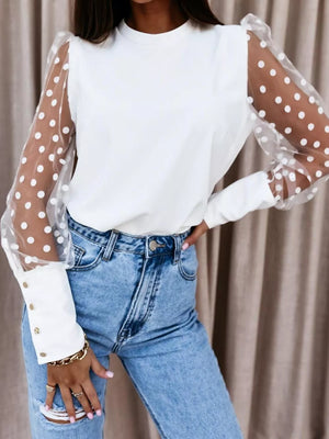 White polka dot sheer sleeve maternity blouse with button cuffs.
