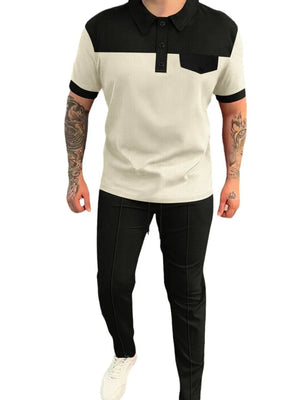 Colorblock polo shirt with black collar and pocket, paired with black track pants.