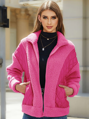 Pink quilted zip jacket with sherpa panels and a stand-up collar.