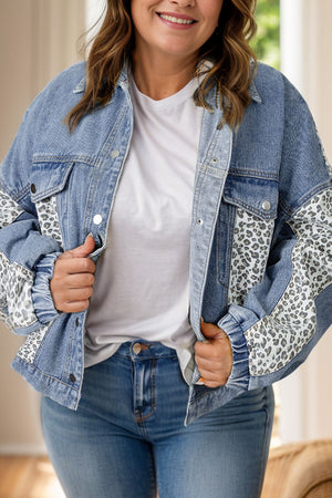 Denim oversized jacket with leopard print panels and button front closure.