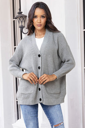 Dark gray oversized ribbed knit cardigan with buttons and pockets.