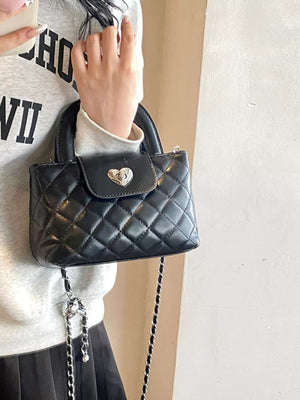 Quilted Heart Lock Crossbody Bag in Black, back view