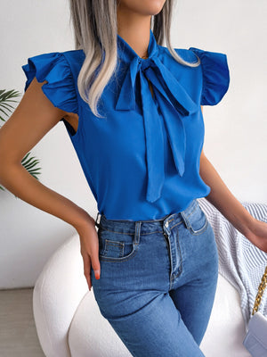 Cerulean ruffled sleeve pussybow blouse with a tie neck.