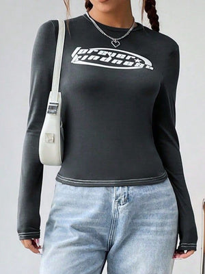Dark gray fitted long sleeve top with white graphic and contrast stitching