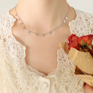Silver Leafs dangling charm chain necklace with delicate leaf charms.