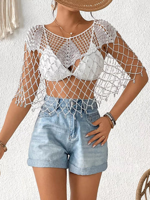 White crochet cardigan with silver beads and fringe detail, V-neck, short sleeves.