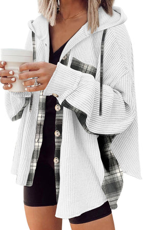White waffle knit shacket with plaid trim and hood, button front, styled with a black top.