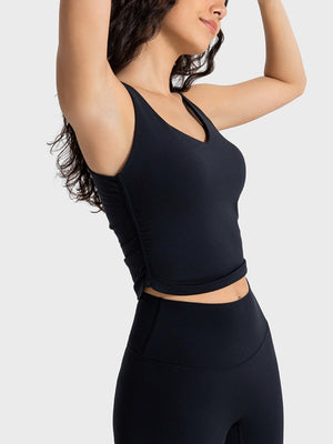 Black sculpted ruched tank top with V-neck and athletic fit.