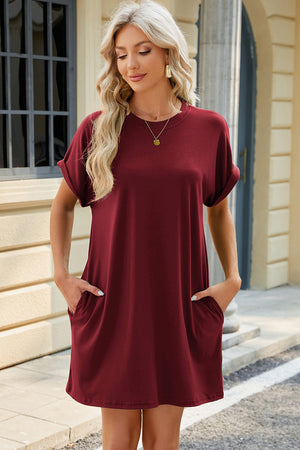 Burgundy casual dress with cuffed short sleeves, crew neck, and side pockets.