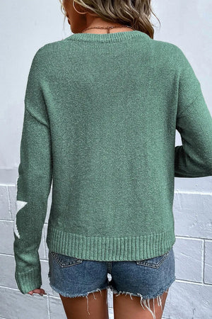 Sage knit jumper with white stars on the sleeve, crew neck, long sleeves, and ribbed hem.