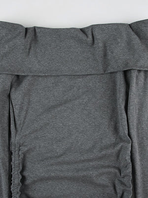 Grey ruched bodycon mini dress with drawstring detail and off-shoulder neckline.