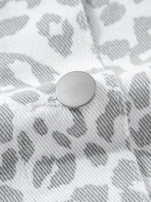 White denim jacket with stone-washed leopard print and button detail.
