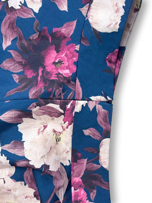 Ruffled floral two-piece set in French Blue polyester with pink and white blooms.
