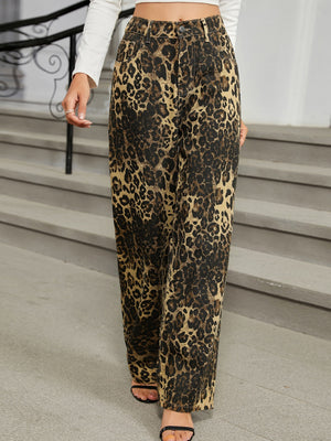 Leopard print wide-leg jeans with a buttoned closure and pockets.