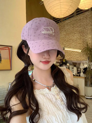 Purple embroidered floral cotton baseball cap with white script detail