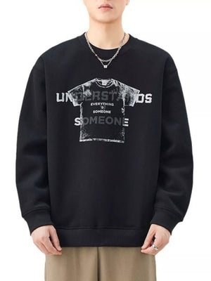 Men's black oversized graphic sweatshirt with crewneck and distressed print.