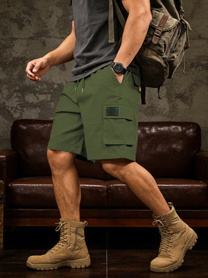 Army green cargo shorts with drawstring waist and multiple pockets.