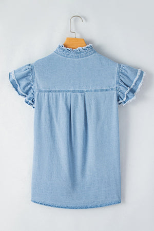 Light blue denim button-up shirt with frayed ruffle trim on collar and sleeves