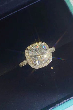 White cushion-cut halo engagement ring with diamond band