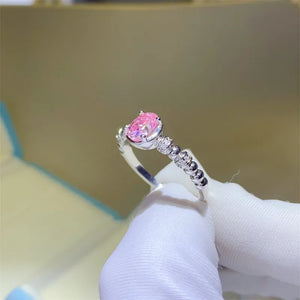 Silver ring with oval pink moissanite and beaded band