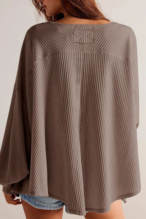 Waffle knit blouson sleeve top in mocha with a relaxed fit and unique yoke detail.