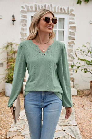 Light green eyelet yoke blouse with blouson sleeves and v-neck detail