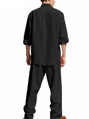 Black linen blend casual two-piece set with rolled sleeve shirt and wide-leg pants.