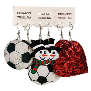 Festive sports trio earrings set with soccer ball, snowmen, and red glitter hearts.