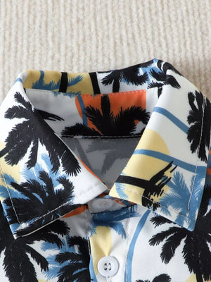 Baby cotton shirt with multicolor palm tree print and button closure.