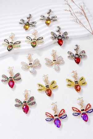 Jeweled dragonfly chandelier earrings in white, deep rose, gold, red, green, orange-red, red-violet.