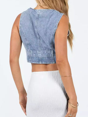 Light blue denim vest with button detail and adjustable waist strap.