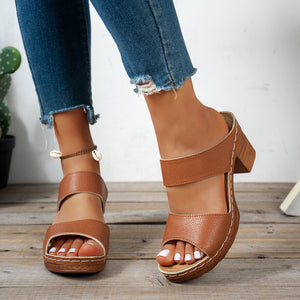 Brown textured strap block heel sandals with open toe and white stitching detail.