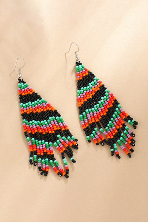Beaded Christmas tree drop earrings in black, orange, green, and purple.