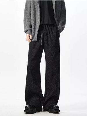 Textured black wide leg drawstring sweatpants with adjustable tie.