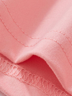 Blush pink toddler tee and shorts set fabric detail with visible stitching.