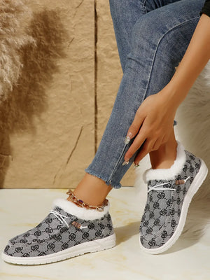 Southwestern print faux fur lined loafers in gray with white laces and wooden toggles.
