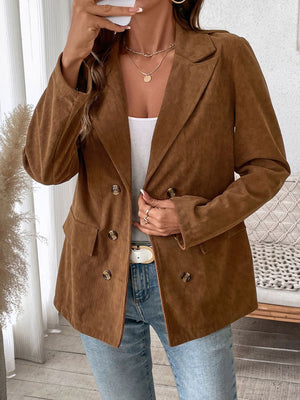 Brown corduroy double-breasted blazer with notched lapels and button front.