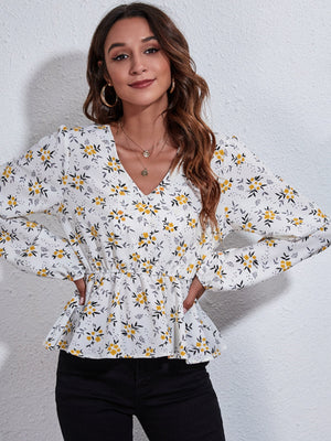 White floral peplum blouse with gathered waist and V-neck