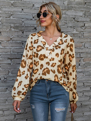 Leopard print henley blouse with blouson sleeves in beige and brown.