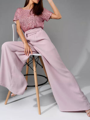 Dusty pink palazzo pants with a sequin bodice top.